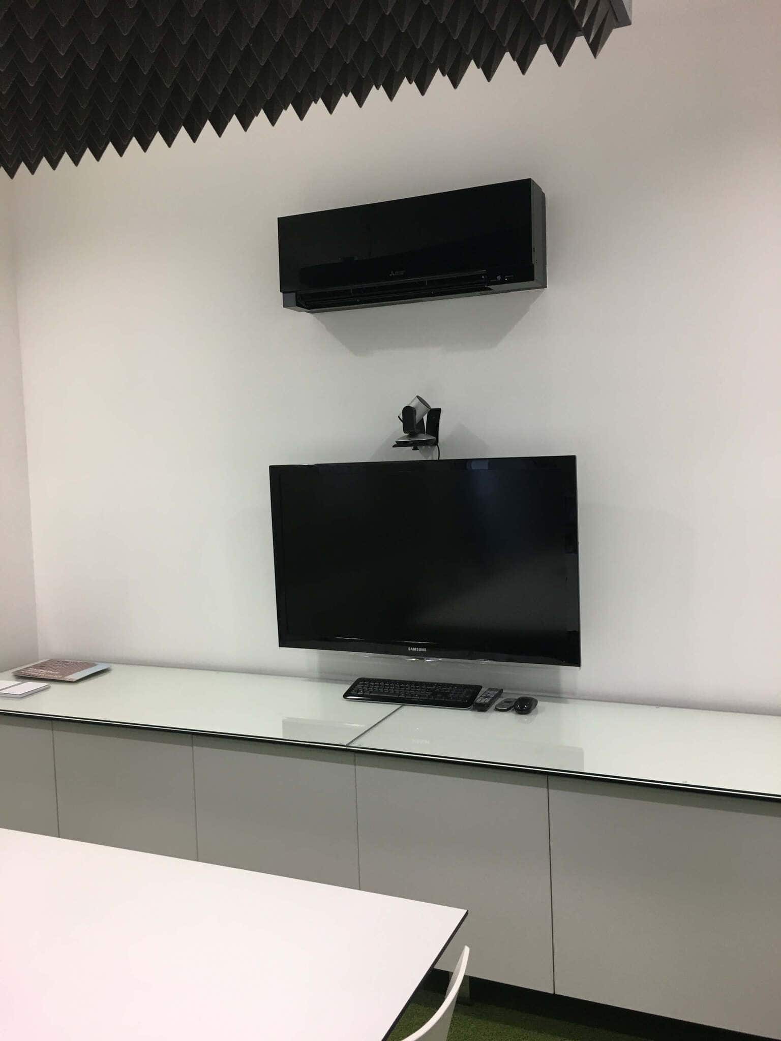 Air conditioning unit above computer